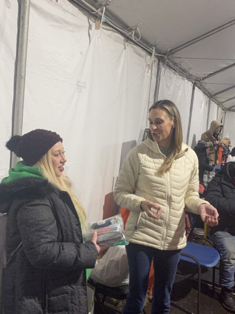 Meredith interacting with another volunteer