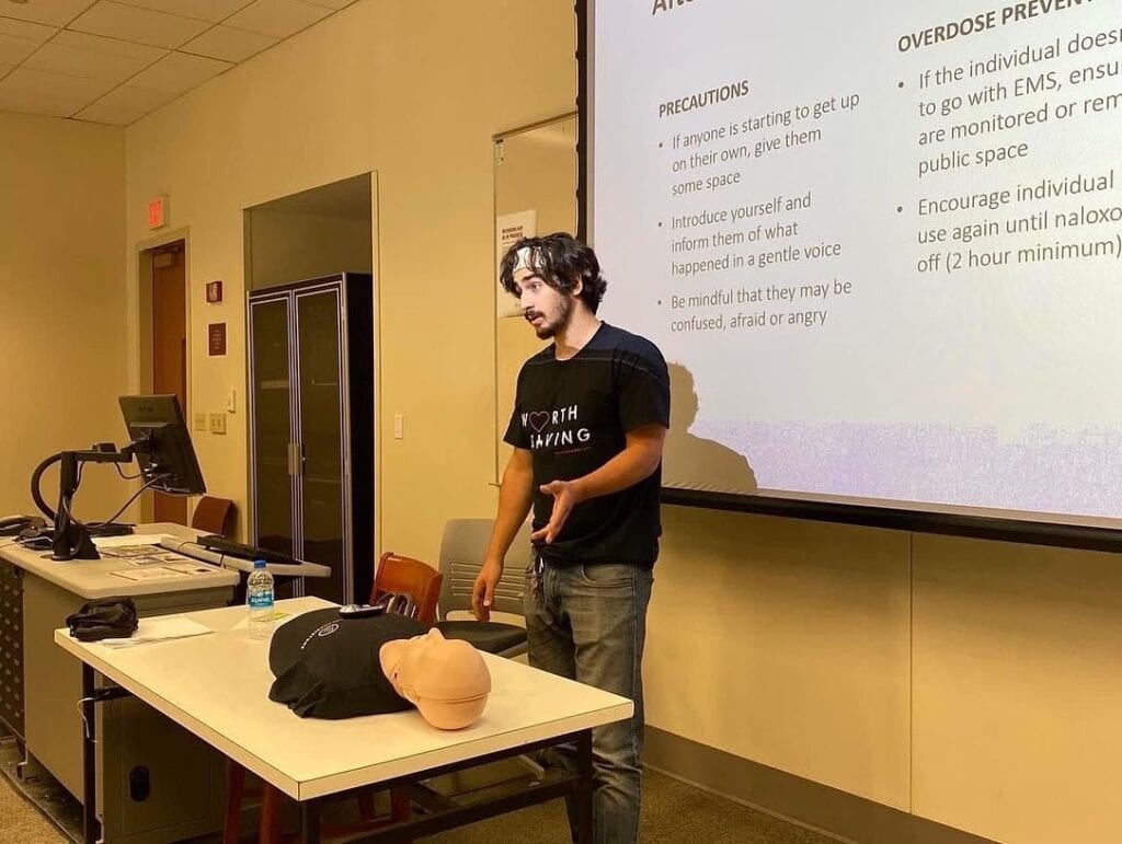 Adam Al-Asad talking during a presentation