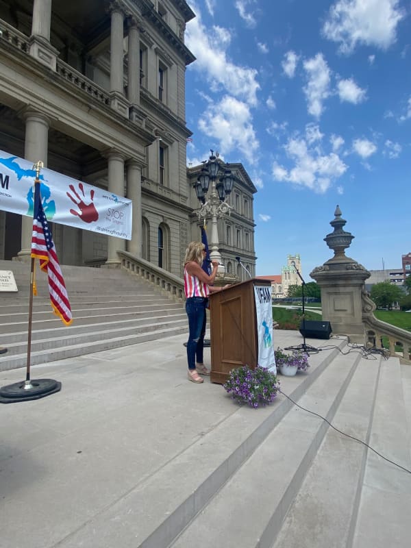 Katie Donovan speaking at a podium at an event