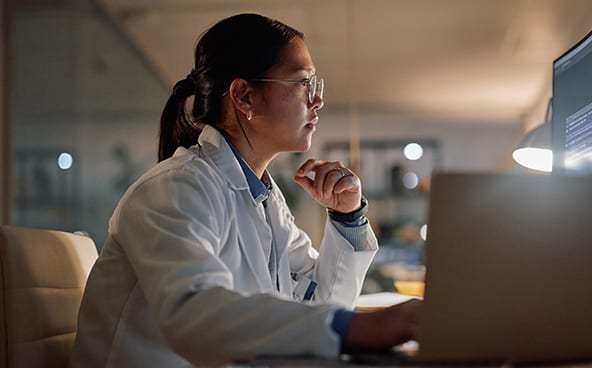 A woman works at her computer